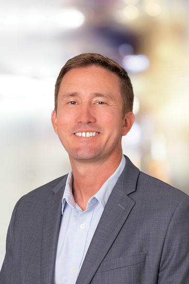 Portrait of Corey Mahoney, REALTOR® | ABR® | RSPS | NRLUX.